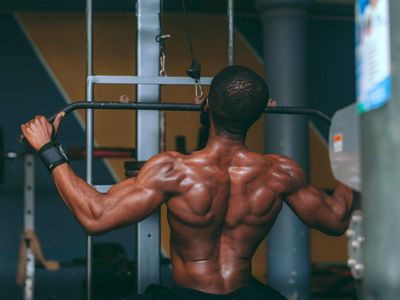 Man doing a controlled strength exercise focused on form.